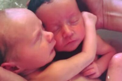 Newborn twins won’t stop cuddling like they did in the womb